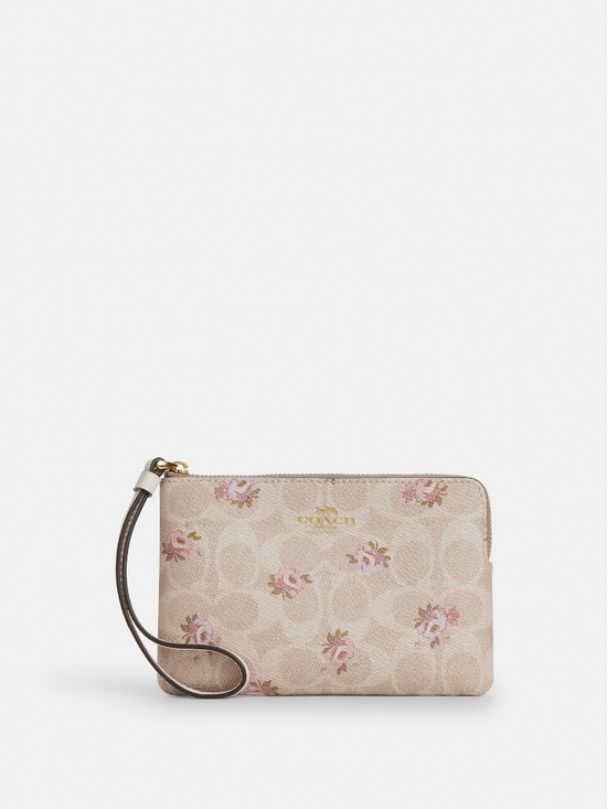Coach Handbags - Coach Beige Floral Signature Wristlet Clutch with Pink Accents